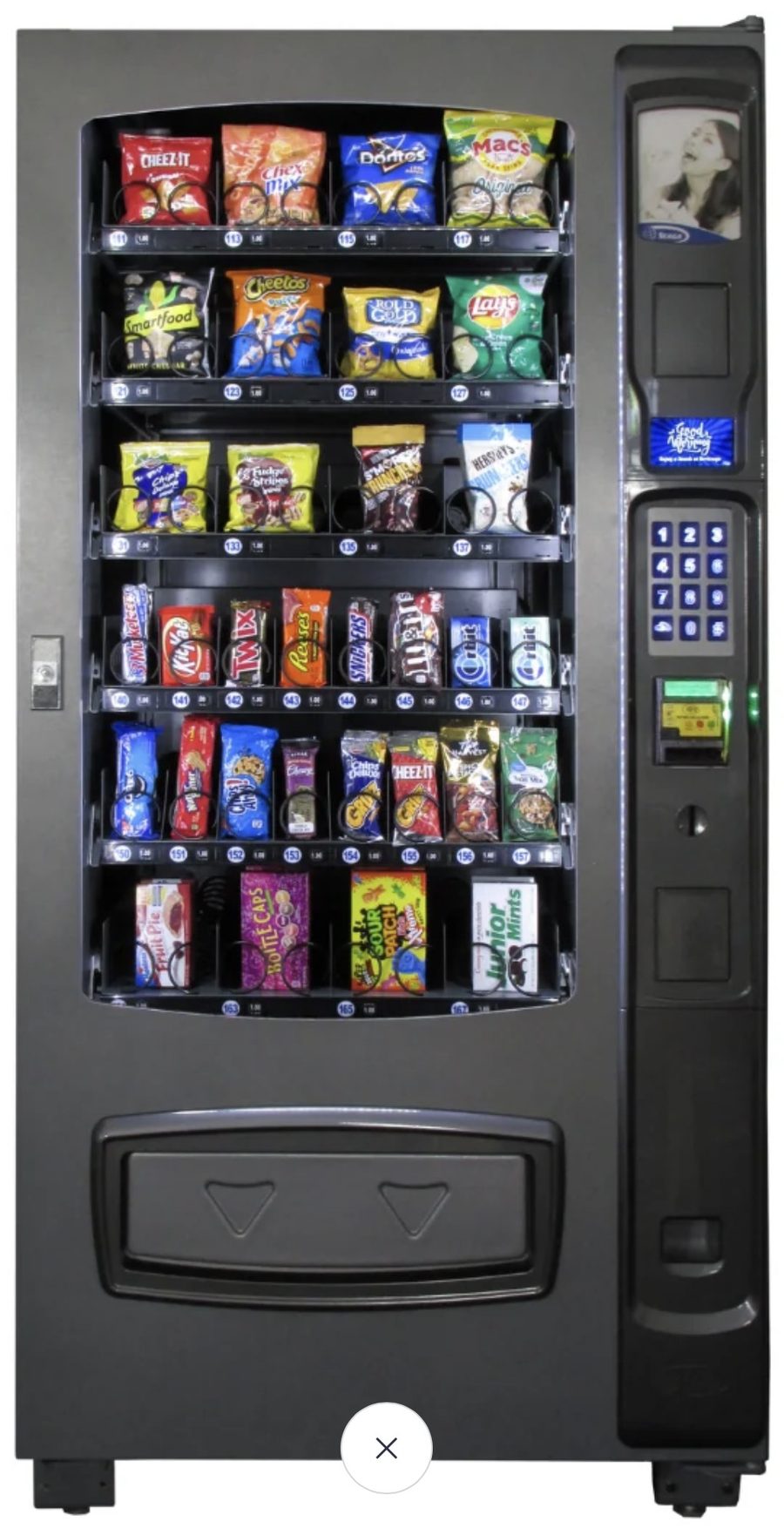 Fully stocked snack vending machine with chips, candy, and cookies